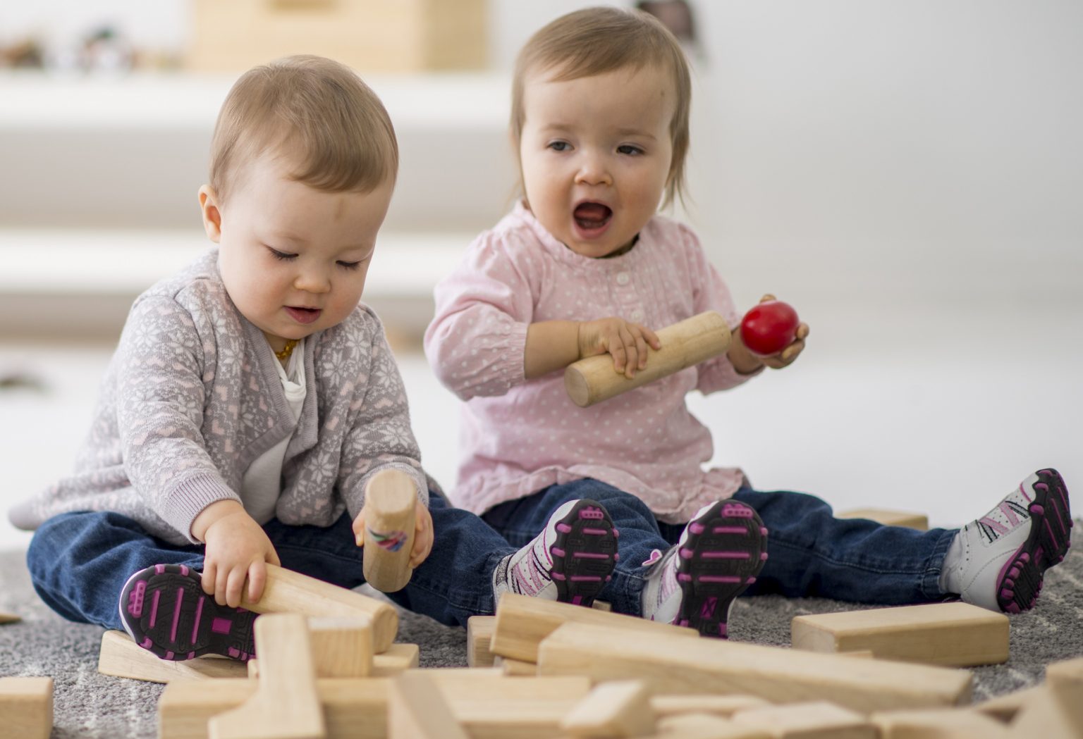 Toddlers Playing with Wooden Blocks